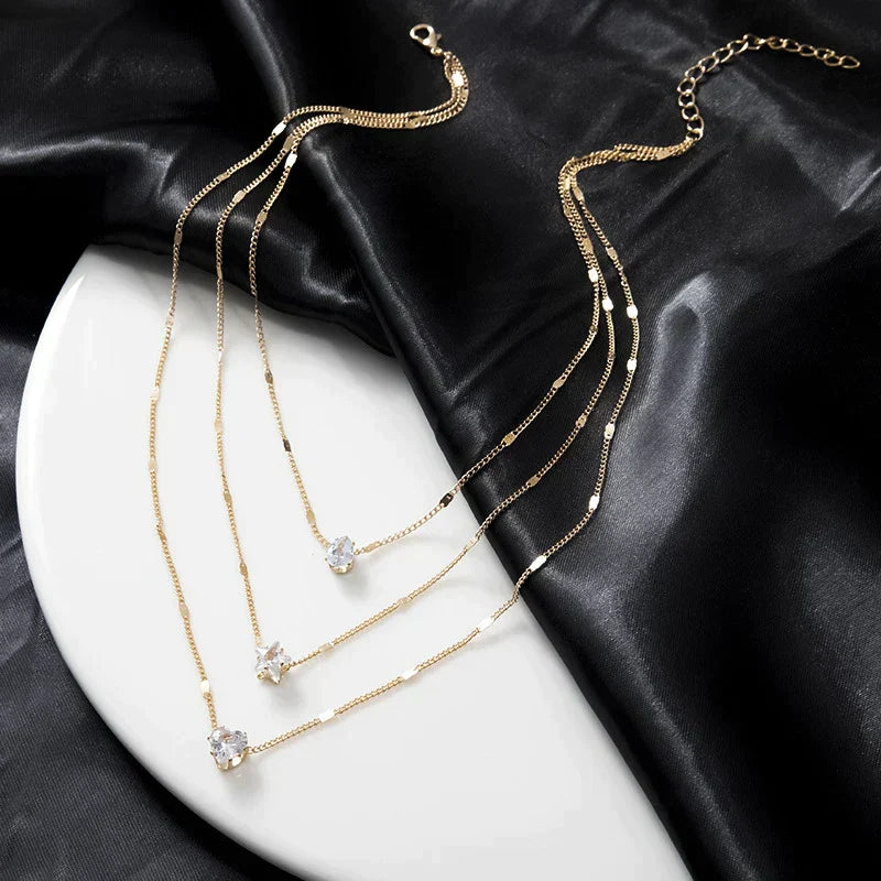 Three Hanging Necklaces with Gold Zirconia