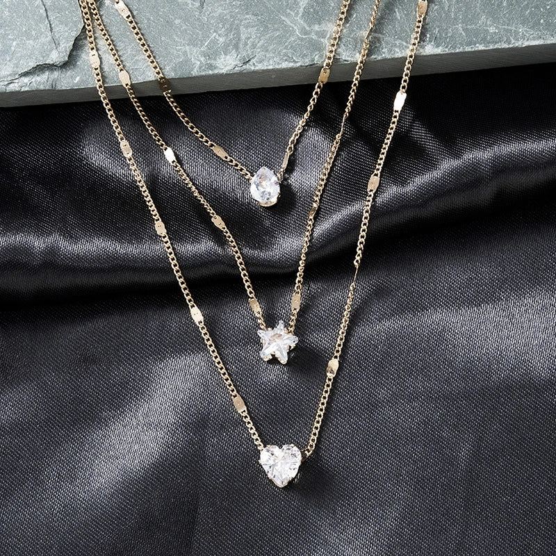 Three Hanging Necklaces with Gold Zirconia