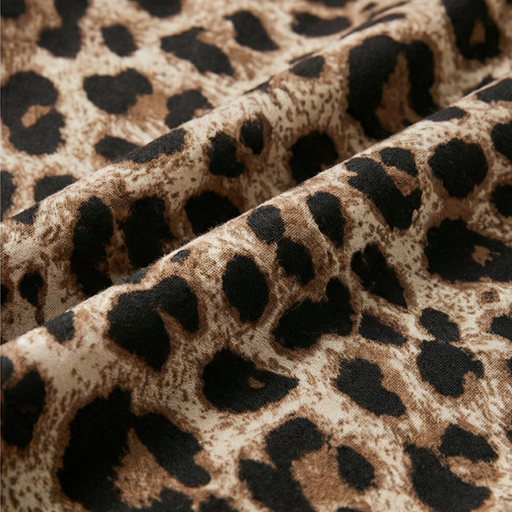 Anna-Berg | Statement Maxi Dress In Leopard Print With V-neck And Short Sleeves